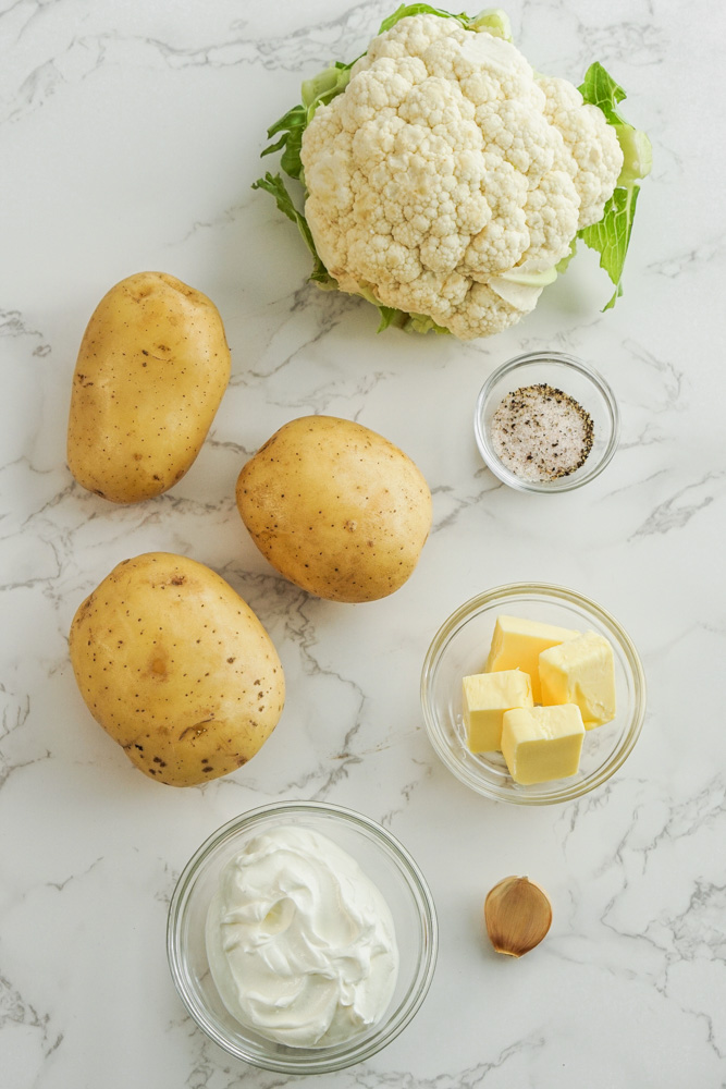 Ingredients laid out for cauliflower and potato mash