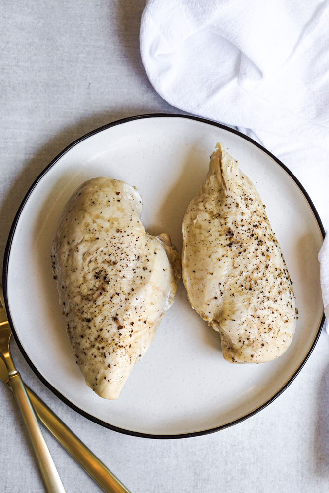 two chicken breast on white plate