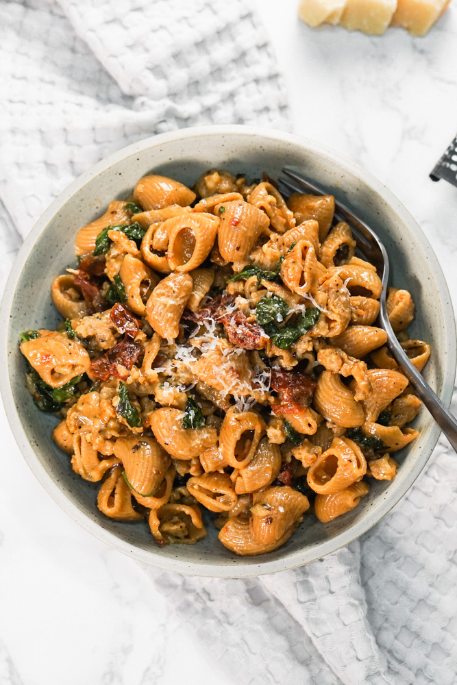 Sun Dried tomato protein pasta with sausage in a bowl