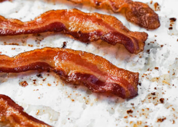 Oven baked Bacon on parchment paper
