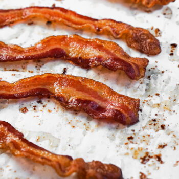 Oven baked Bacon on parchment paper