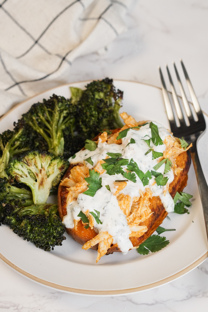 Buffalo chicken stuffed sweet potato with broccoli