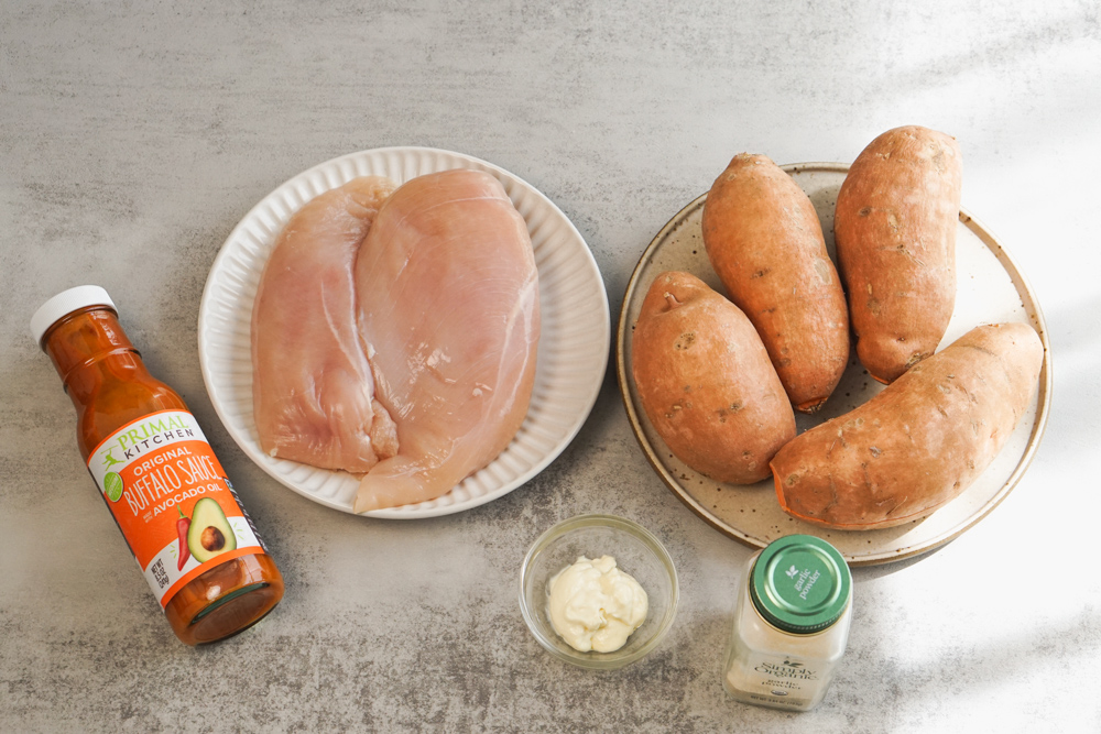 ingredients for buffalo chicken and sweet potato on counter